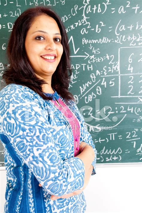 Young Confident Cheerful Indian Mathematics Teacher In A Classro Stock