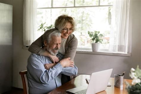 Excited Mature Couple Celebrate Good News On Laptop Stock Image Image Of Older Look 221715995