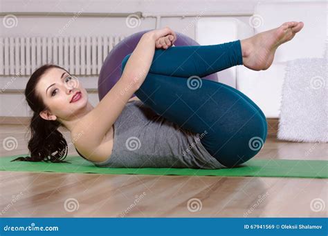 Girl Pulled Her Knees Up To Her Chest While Lying On The Floor Stock Image Image Of White