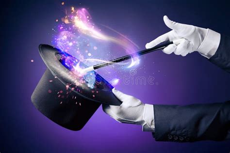 High Contrast Image Of Magician Hand With Magic Wand Stock Photo