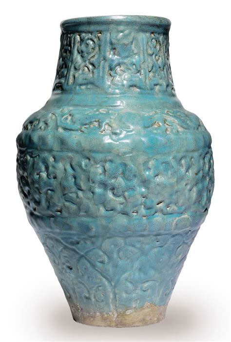 a turquoise glazed moulded pottery jar seljuk iran 12th or early 13th century christie s