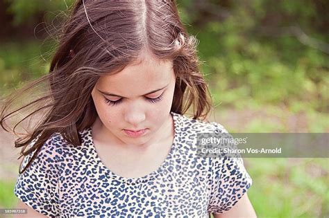 Young Girl Looking Down Pensive High Res Stock Photo Getty Images