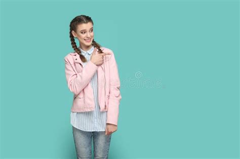 Smiling Positive Happy Teenager Girl Pointing Aside At Advertisement
