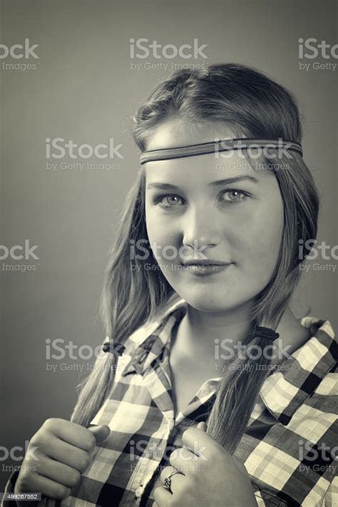 Monochrome Studio Portrait Of 1960s Hippie Girl Stock Photo Download