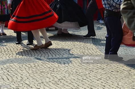 Dancers In Traditional Portuguese Dress Take Part In Folk Dancing At