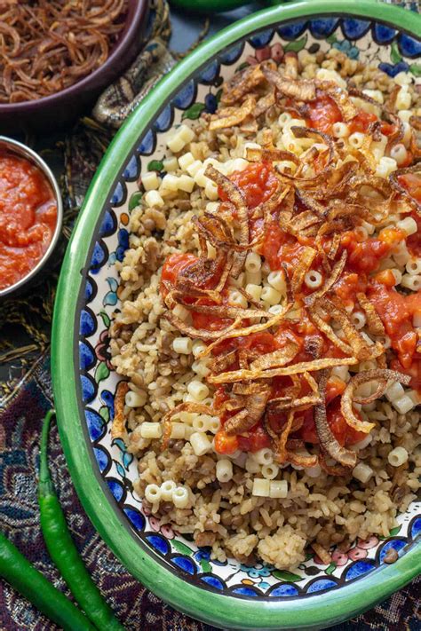 Kushari Egyptian Rice Lentils And Pasta With Spicy Tomato Sauce