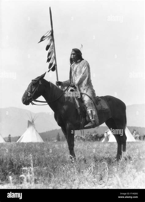 1920s Single Native American Stoney Sioux Indian Man Sitting On Horse