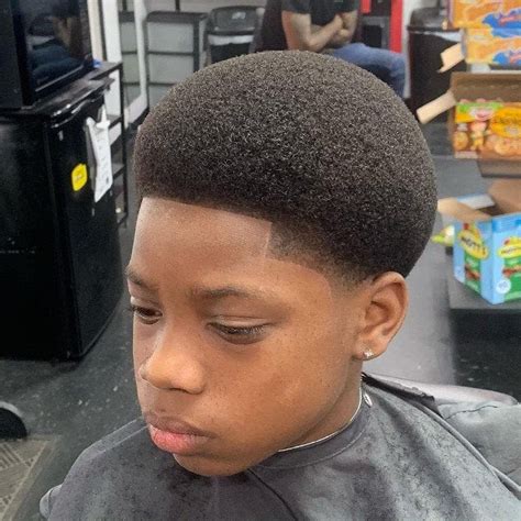 One of the best haircuts you can try when you have curly hair is this fake mohawk or fauxhawk. 15 Excellent Curly Haircuts for Black Boys + Styling Tips ...
