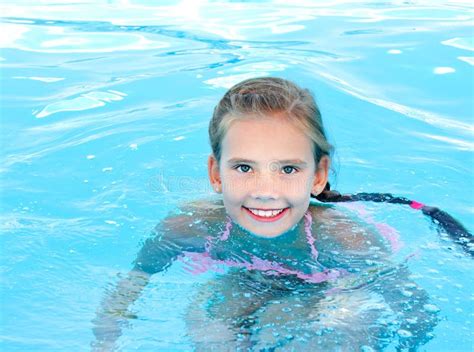 Cute Smiling Happy Little Girl Child In Swimming Pool Stock Image