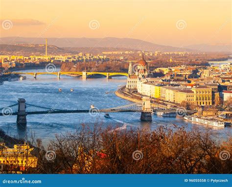 Budapest Cityscape With Parliament And Chain Bridge At Sunset Time