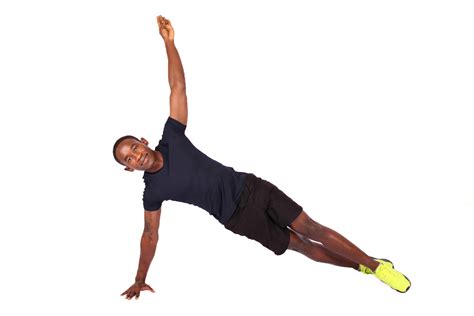 Athletic Male Doing Side Plank With One Arm Raised
