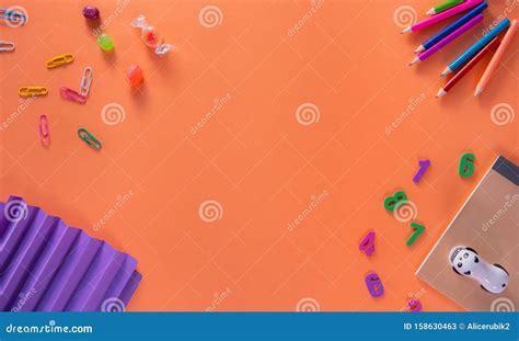 Colored Different School Supplies On Orange Background Back To School