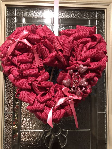 A Heart Shaped Wreath On The Front Door