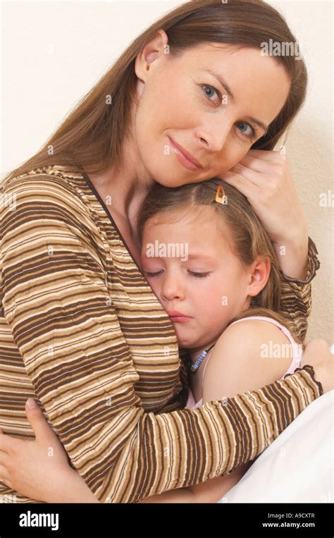 Portrait Of Mother Comforting Her Little Daughter Stock Photo Alamy