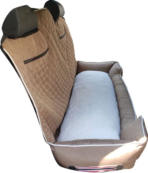 An Animal Shaped Car Seat Cover With A Pillow In The Back And Head On It