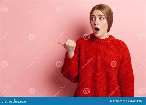Photo Of Shocked Woman Expressing Surprise And Pointing Finger Aside Stock Image Image Of