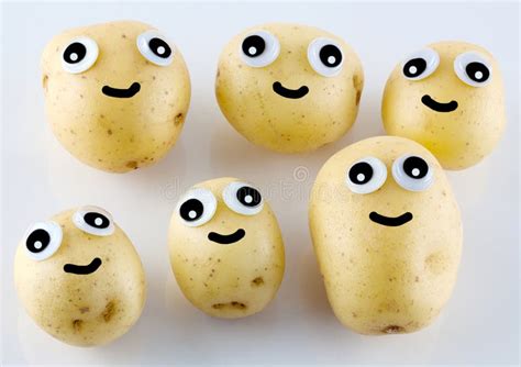 Six Cheerful Little Potatos With Eyes And Smiles Stock Photo Image Of