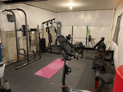 Gym flooring is essential for protecting your equipment and floors. Unfinished basement gym - I love these rubber floor tiles ...