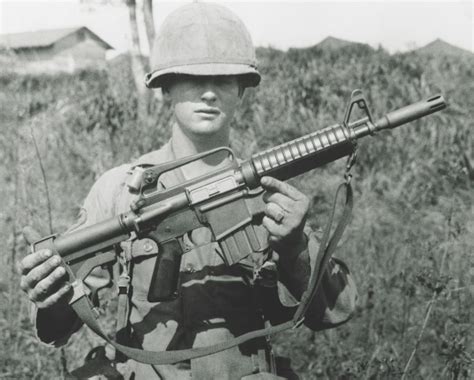A Shorter Variant Of The M16 The Xm 177e2 Displayed At Left By A