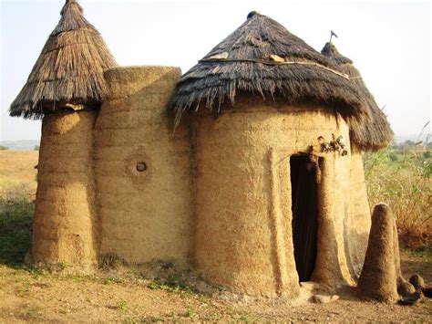 An Old Mud Hut With Thatched Roof