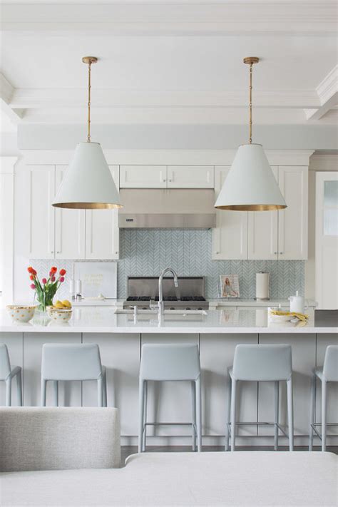 Nope, white kitchens don't have to be stark and minimalist, you can create a lovely cozy, inviting space and still have the all white kitchen of your dreams. White and grey with gold accents kitchen - Daily Dream Decor