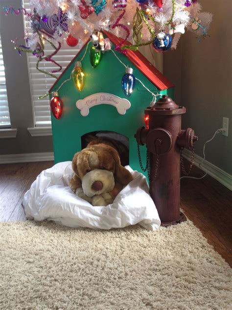 Bo inspects the white house christmas decoration? Dog house(base of tree) for dog themed Christmas tree ...