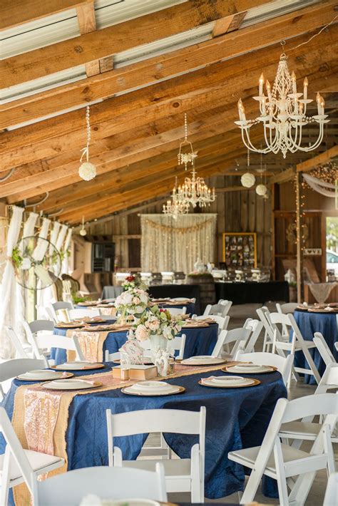 Long farm table, emerald green table garland, vintage bottles, pops of ivory and dusty blue | image by jessie schultz photography. Elegant, Rustic Chic Plant City Barn Wedding | Wedding ...