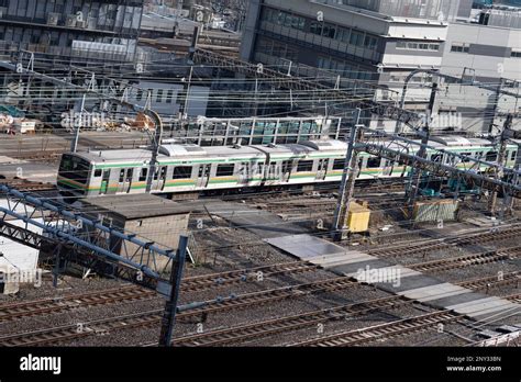 Tokyo, Japan. 6th Feb, 2023. A JR East local metro train arrives to