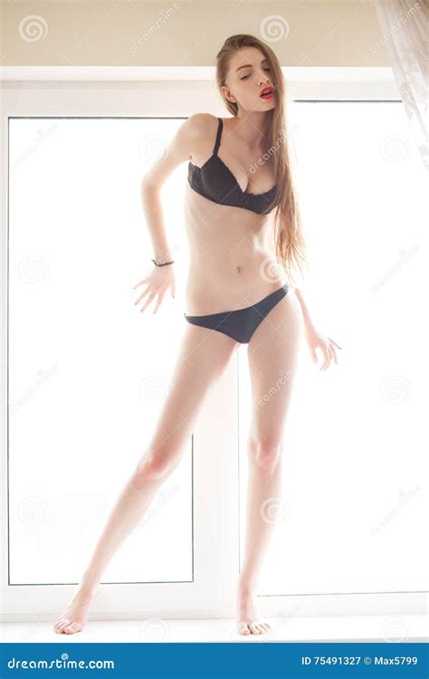 Beautiful Woman Wearing Lingerie Stand On Windowsill Girl Stock Image