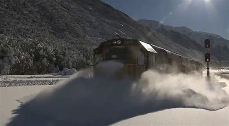 amazing video of train plowing through tracks covered with snow