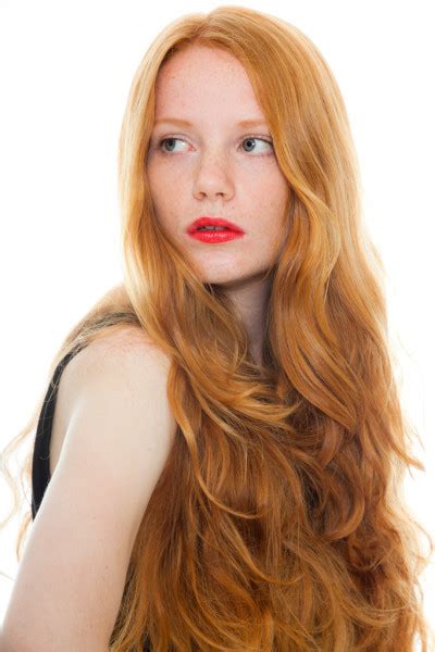 Pretty Girl With Long Red Hair And Lipstick Wearing Black