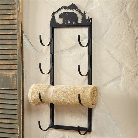 For larger towels, look for wall mounted towel bars or train racks. Bear Wall/Door Mount Towel Rack