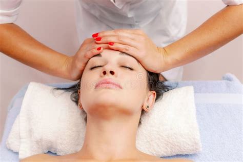 Beautician Massaging Woman`s Face Attractive Girl Having Facial