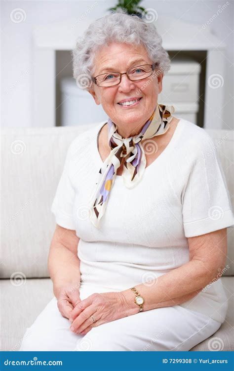 Lifestyle Portrait Of Grandma Sitting On Sofa Stock Photo Image Of
