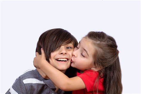 Little Girl Kissing Little Boy Face Stock Photo Download Image Now