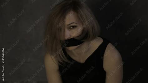 Frightened Crying Girl Gagged Sitting On A Floor With Tied Hands