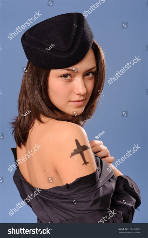 Check spelling or type a new query. Portrait Of A Beautiful Young Flight Attendant With Tattoo Stock Photo 111354839 : Shutterstock