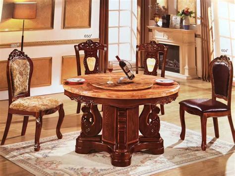 The utility model is characterized in that the outer table and the chairs are fixedly connected with a rotary plate, and the inner table is fixedly connected with a base; European House Furniture Antique Round Rotating Dining ...