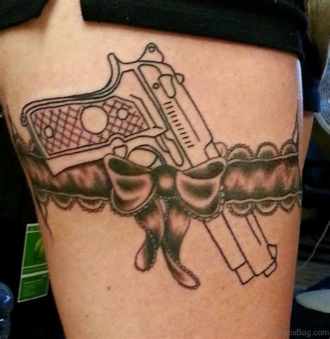 gun tattoos on hips