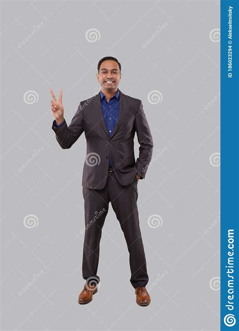 Businessman Showing Peace Sign Indian Businessman Standing Full Length