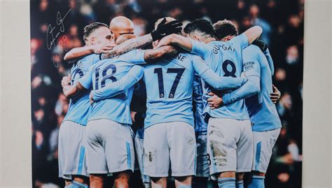 Team Hug Manchester City Squad A2 Signed Photograph