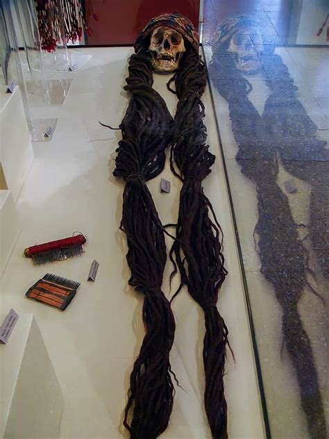 A 1500 Year Old Nazca Skull Of A Woman With Long Braided Hair
