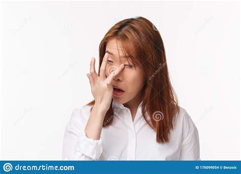 Close Up Portrait Of Young Funny Asian Woman Scratching Eye Rolling It