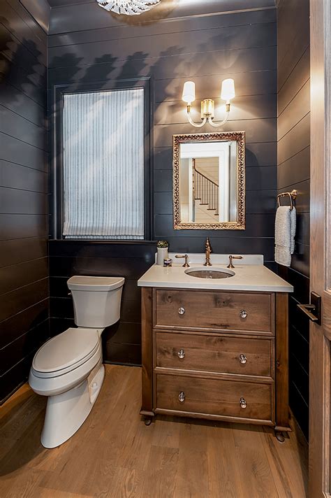 Powder Room With Brown Shiplap Brass Accents And Furniture Style