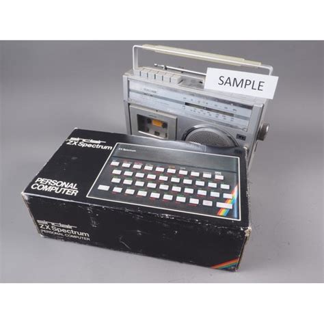 A Sinclair Zx Spectrum 48k Personal Computer In Original Box And An