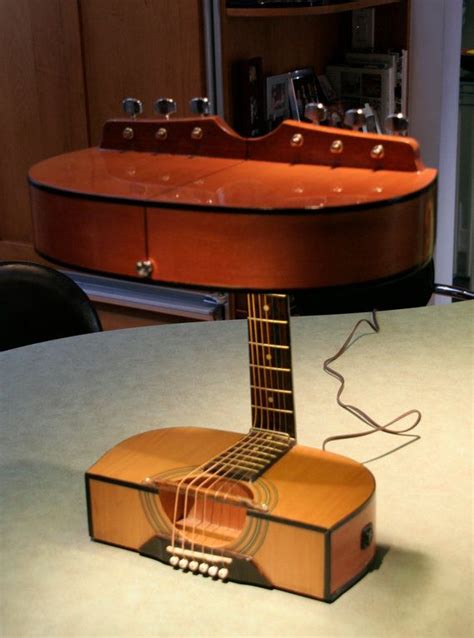# 61 is a recycled acoustic guitar with 4 shelves made from 1/4 poplar wood and 1/2 decorative items similar to acoustic guitar lamp on etsy. acoustic guitar lamps by TonyBruscatoLamps on Etsy, $250 ...
