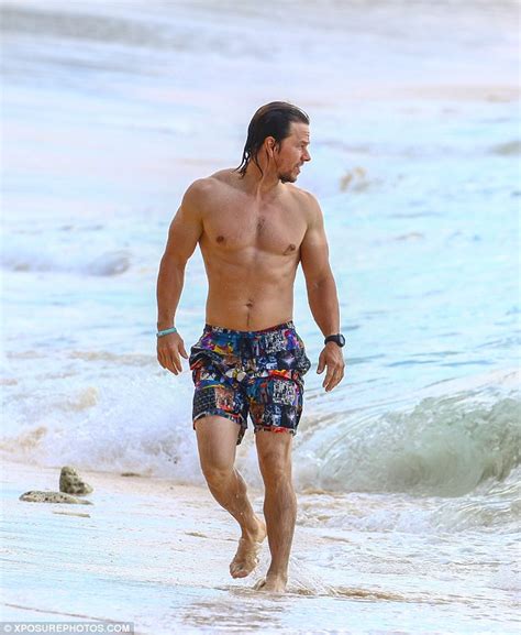 mark wahlberg continues to parade his impressive beach body in barbados daily mail online