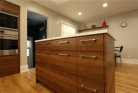 Installing new cabinet knobs, handles or pulls is an easy and inexpensive diy kitchen cabinet update. Horizontal Grain Match Walnut Kitchen Cabinetry ...