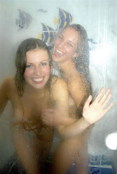 Two Longhair Naked Girlfriends Posing And Teasing In The Shower