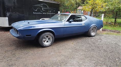 If you love ford mustangs this is the place for you. Cheap and Cheerful: 1973 Mustang SportsRoof - Barn Finds